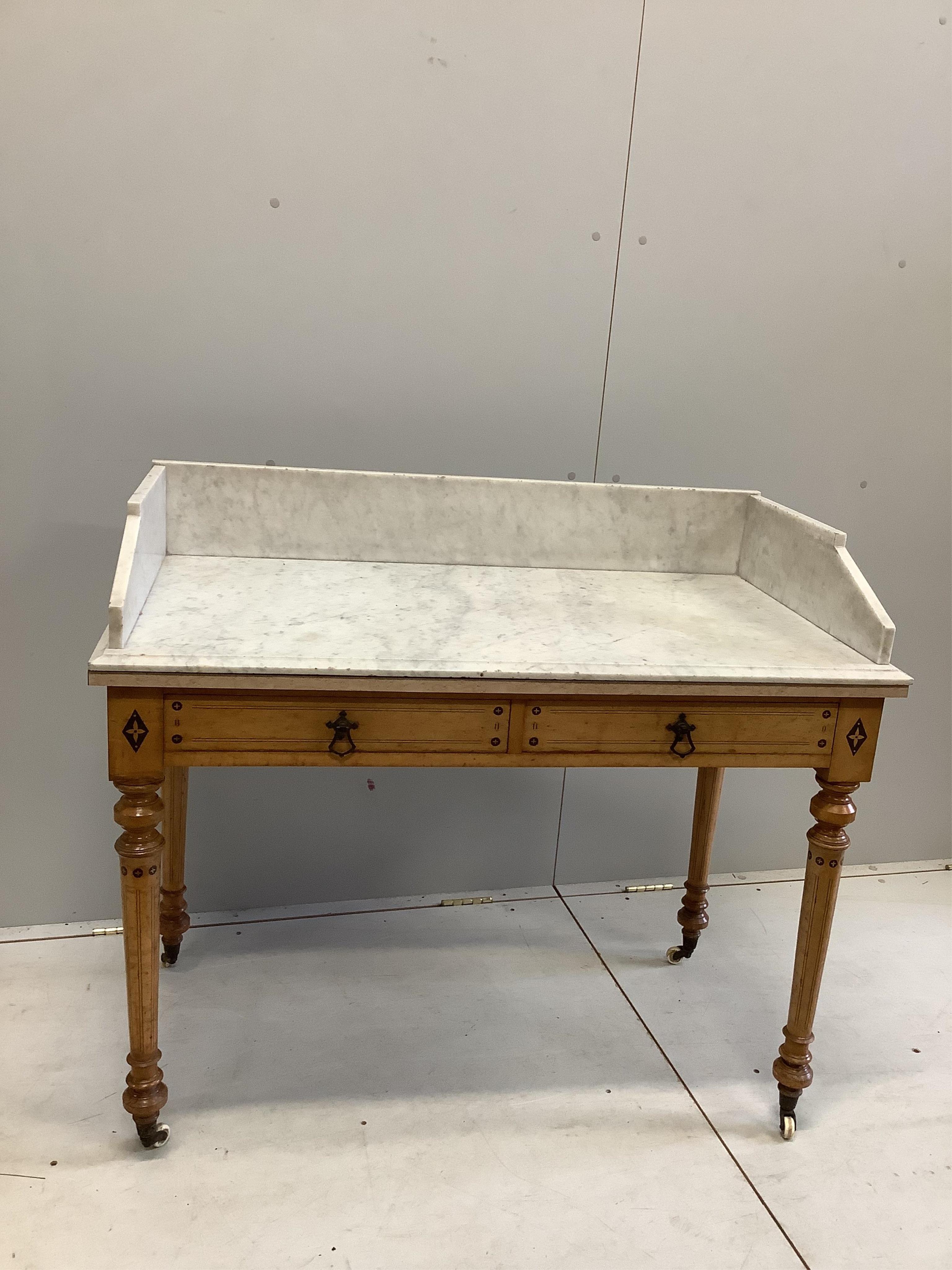 A late Victorian Gothic revival ebony inlaid, bird's eye maple bedroom suite, manner of Charles Bevan, comprising 5ft bed frame, kneehole dressing table, chest of drawers, marble top washstand, bedside cabinet, commode a